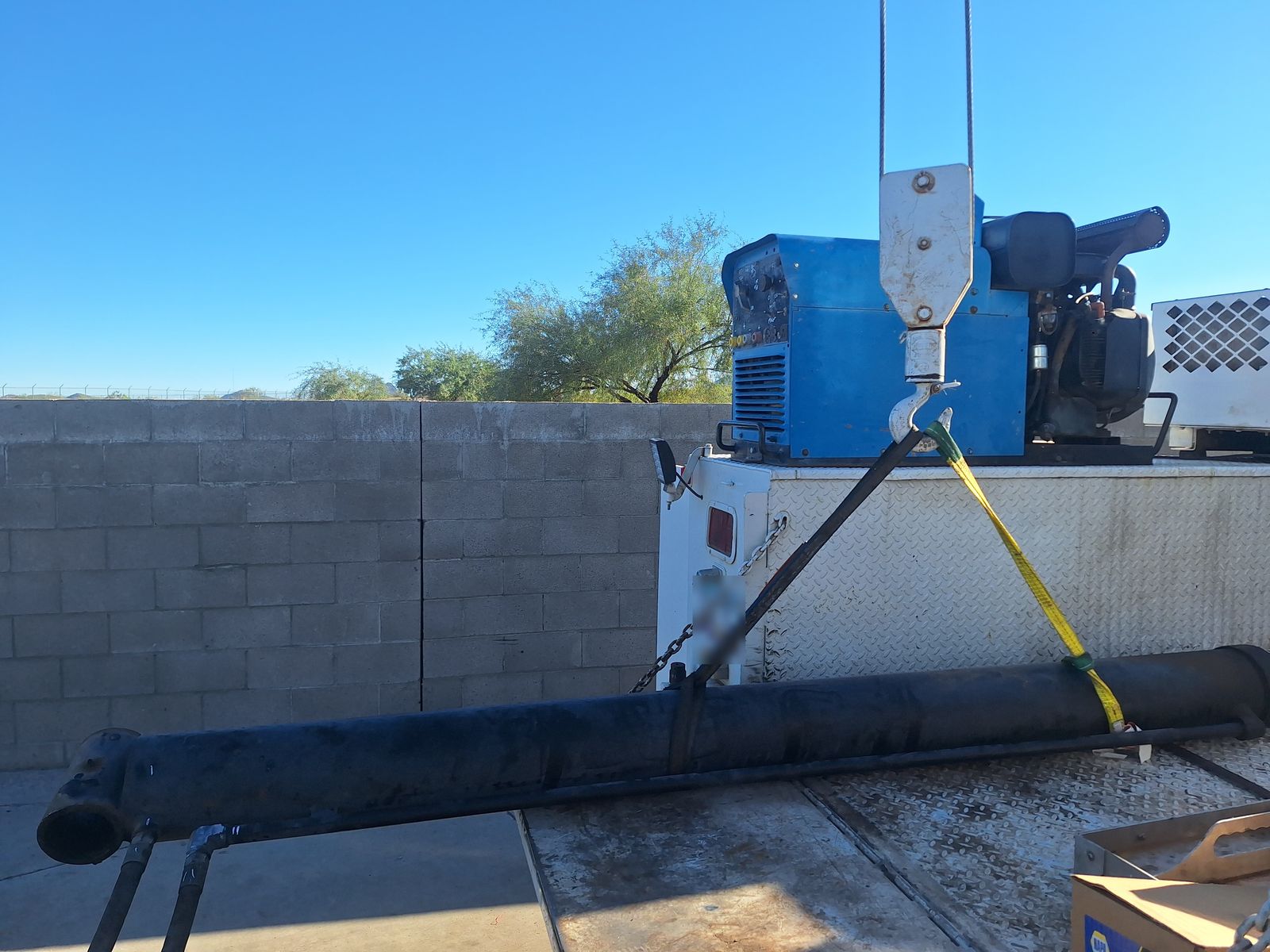 Crane hook and rigging on service truck